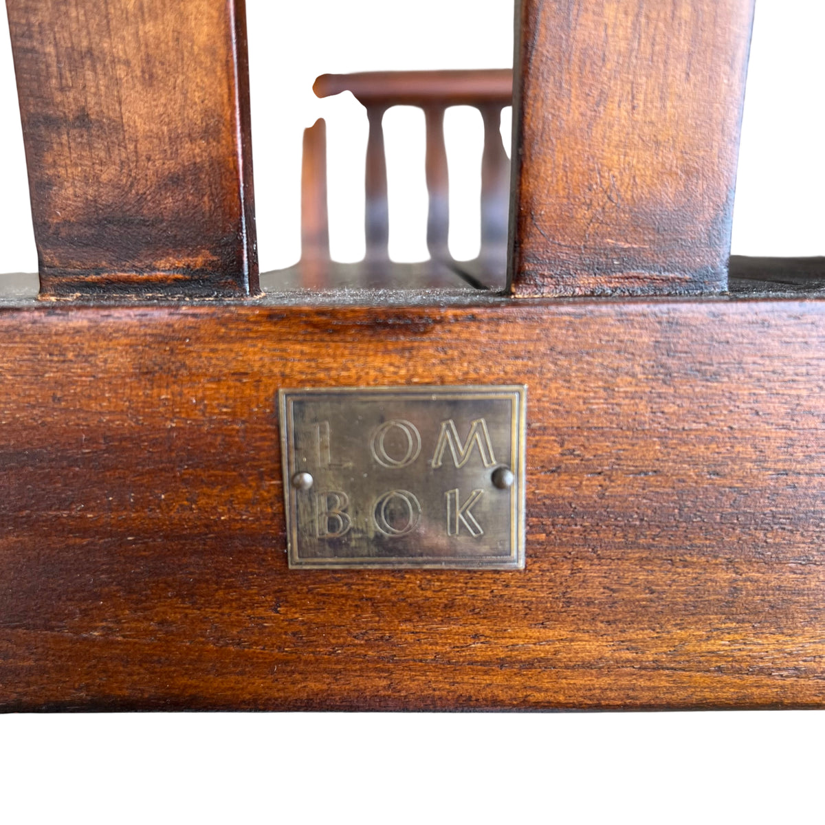 Angled view of Lombok teak hall bench showing full seat and arm detail