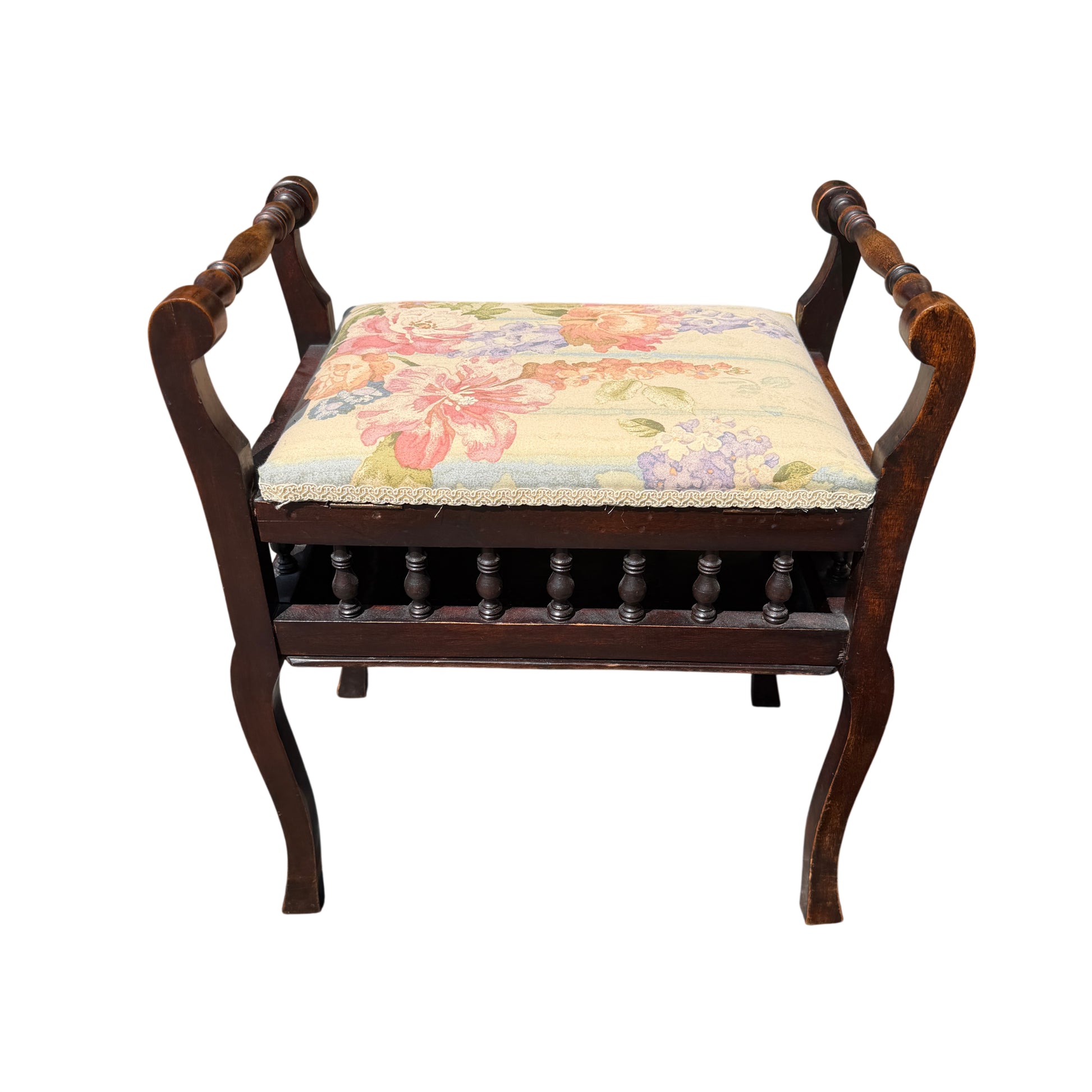 Front view of Victorian upholstery stool showing turned spindle gallery and floral seat