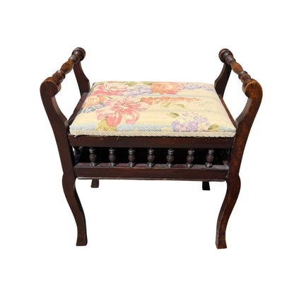 Front view of Victorian upholstery stool showing turned spindle gallery and floral seat