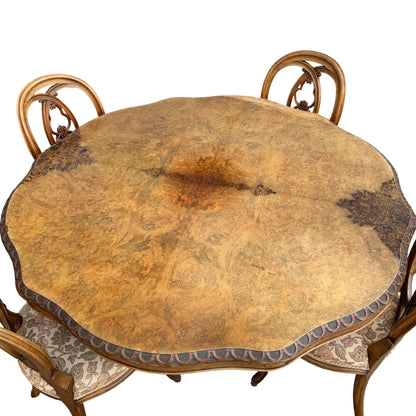 Carved pedestal base of dining table fitted with contemporary castor wheels