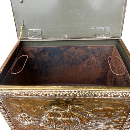 Top view of brass chest lid with multiple sailing vessels in relief