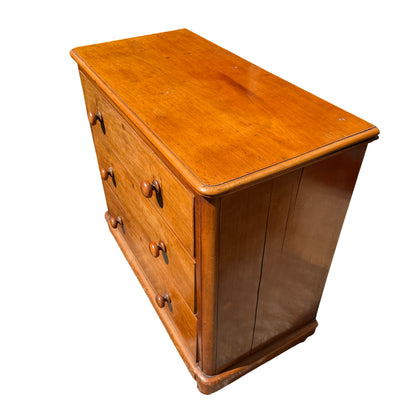 Side panel view showing vertical pine boards on antique chest