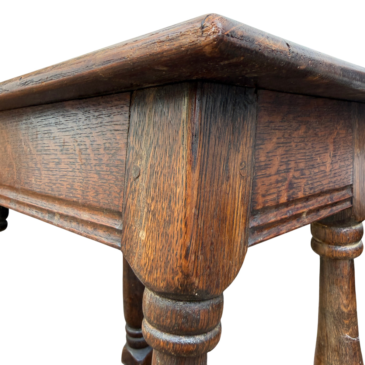 Side view of vintage oak joint stool table showing pegged top and leg detail