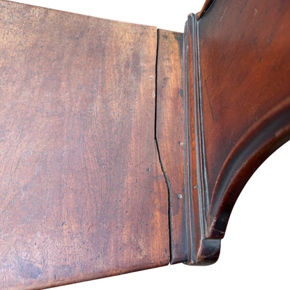 Solid wooden seat and scuffed finish on Victorian mahogany chair