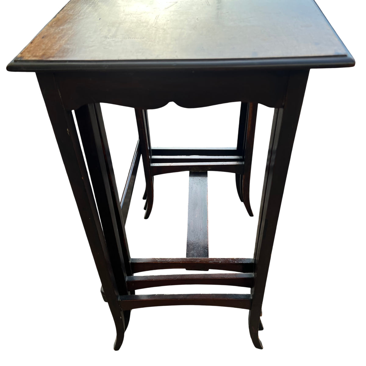 Detail of table edge with darker trim and lighter timber top on nesting table