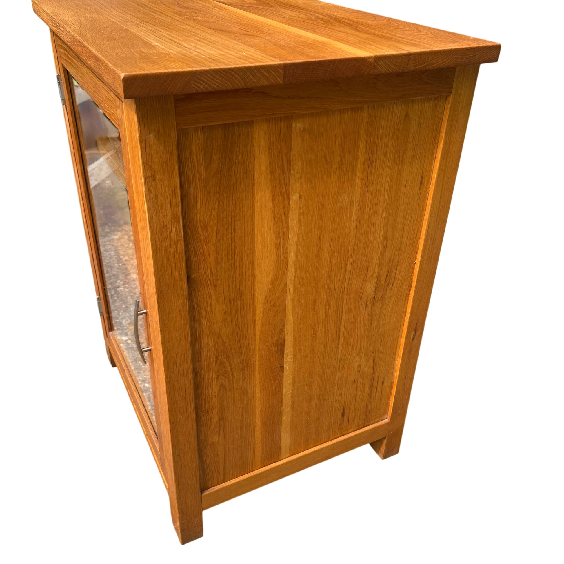 Top view showing oak grain and solid board top of glazed display cabinet