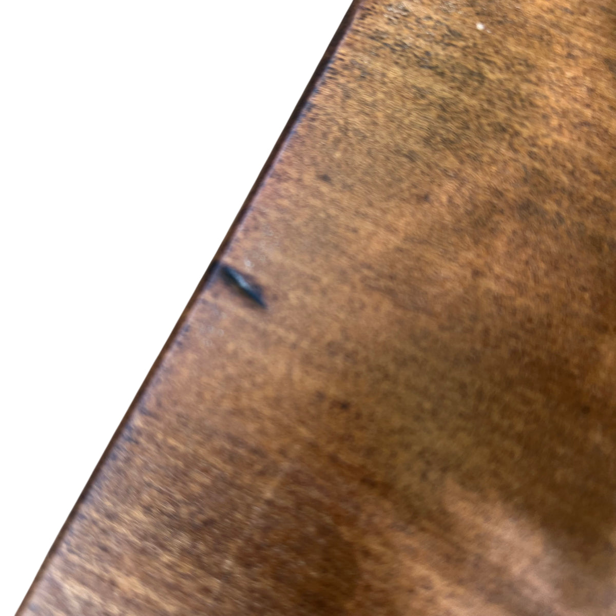 Lower shelf of oak hall table showing consistent finish and light surface marks