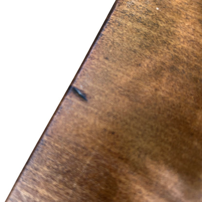 Lower shelf of oak hall table showing consistent finish and light surface marks