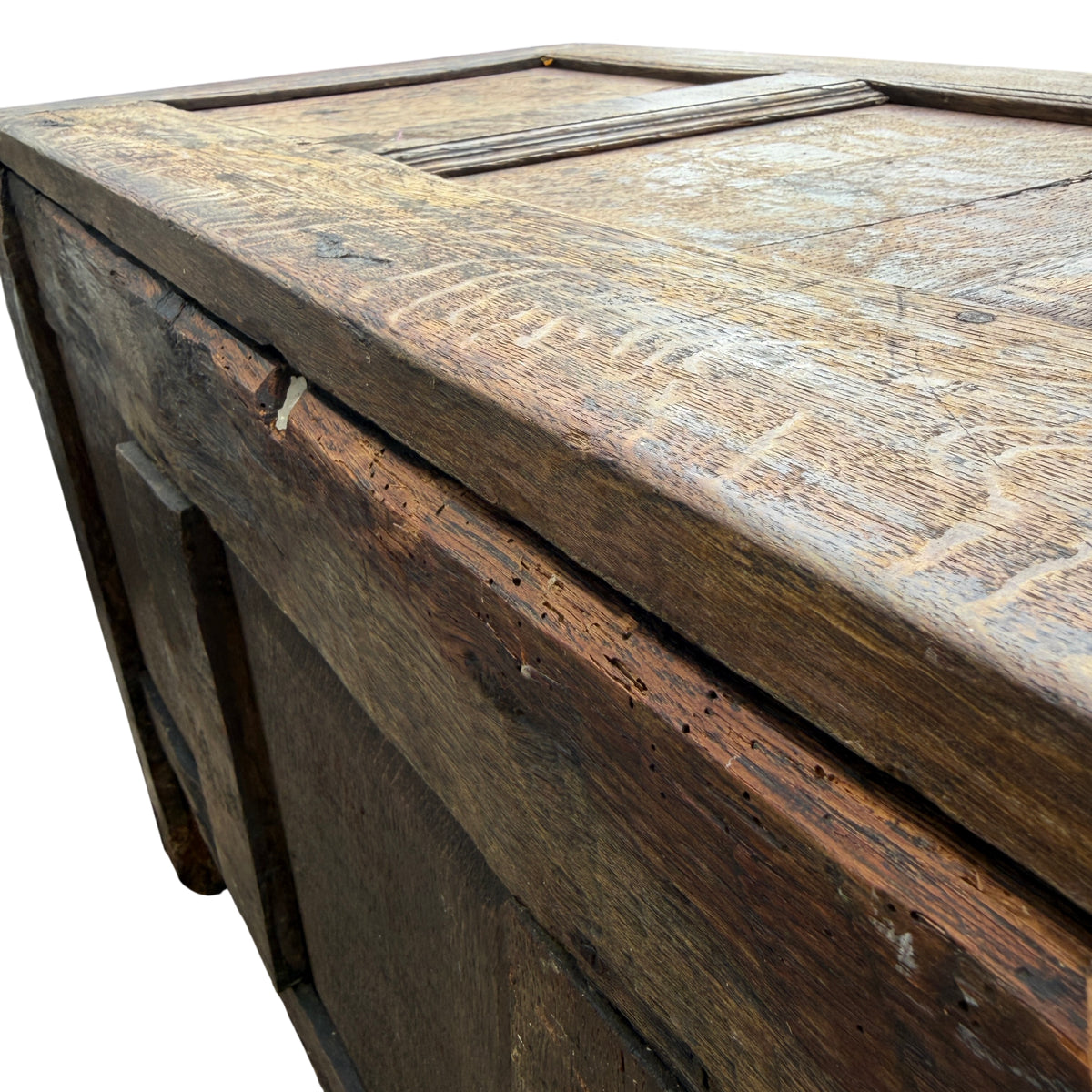 Close-up of brass escutcheon on the front of carved oak storage chest