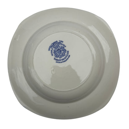 Overhead view of three matching Burleigh Ware blue and white bowls on studio backdrop