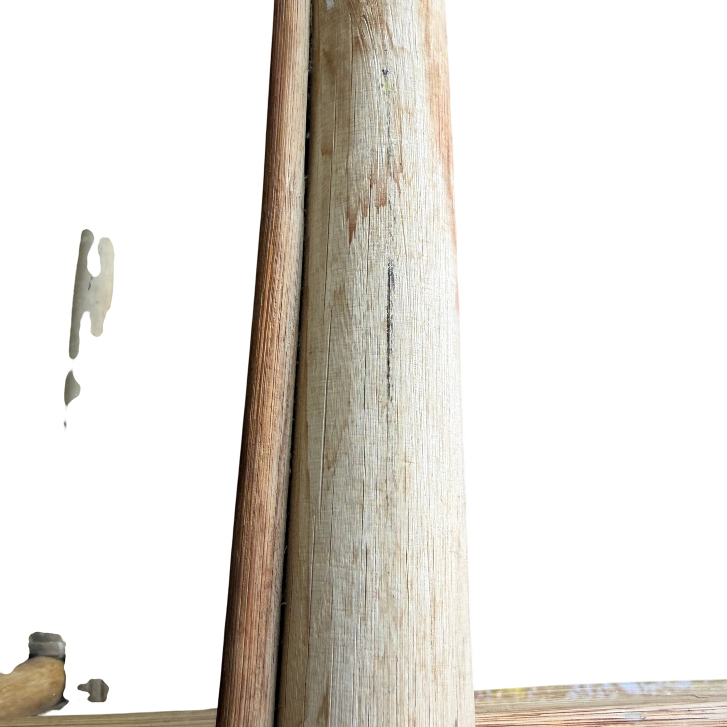 Vintage cane nest tables with visible sun-bleached finish and surface marks