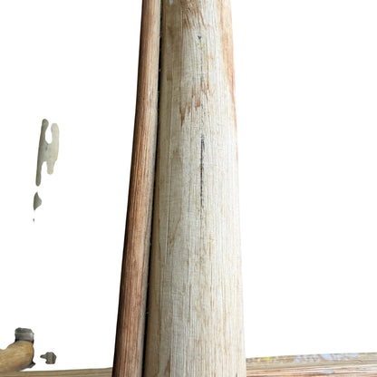 Vintage cane nest tables with visible sun-bleached finish and surface marks