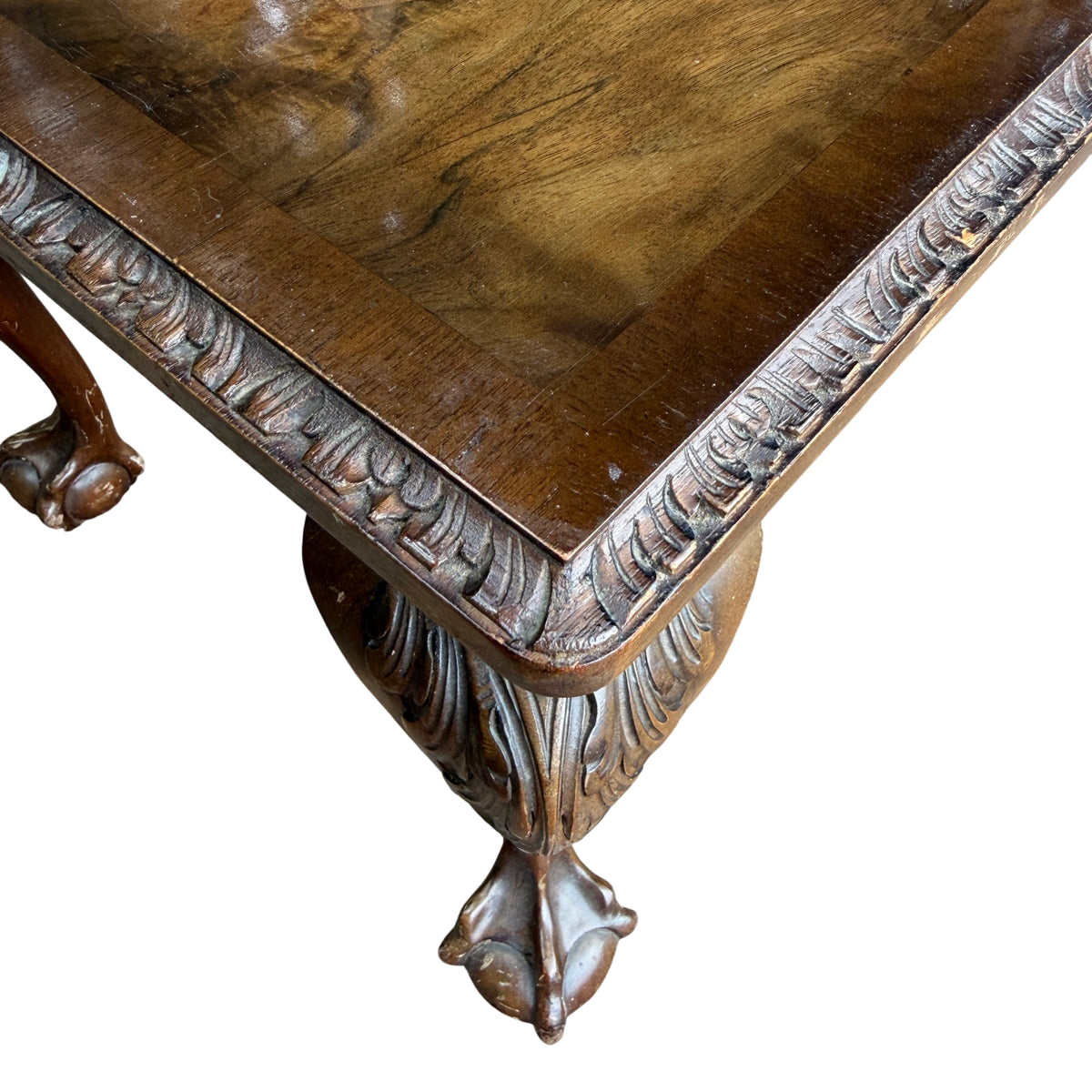 Detail of carved apron and edge trim on burr walnut coffee table