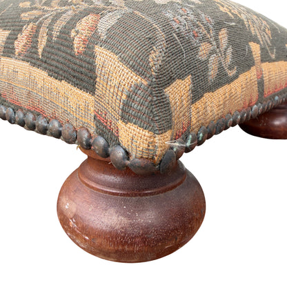 Top view of square tapestry footstool with woodland animals and floral design