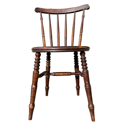 Detail of turned stretchers and legs on a vintage stickback dining chair