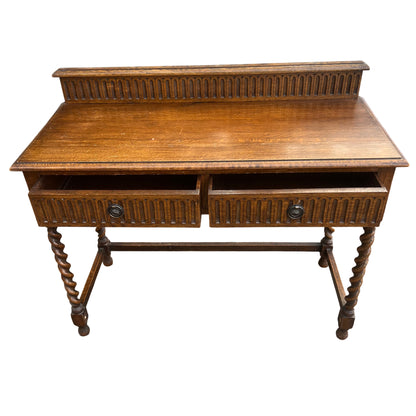Detail of metal drop handles on oak console table drawers