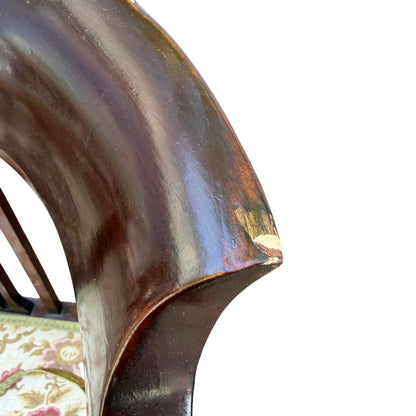 Mahogany corner chair placed outdoors showing overall form and finish