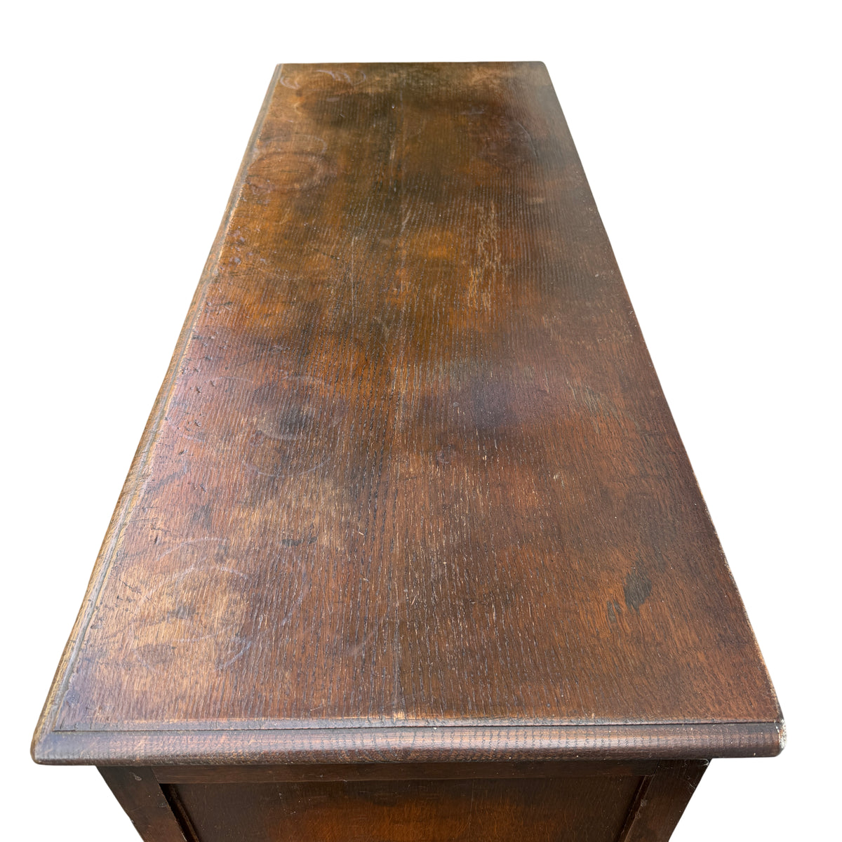 Side view oak cabinet on stand showing turned leg and plank lower shelf
