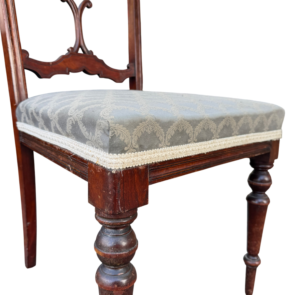 Detail of turned front leg and stretcher on Edwardian mahogany chair