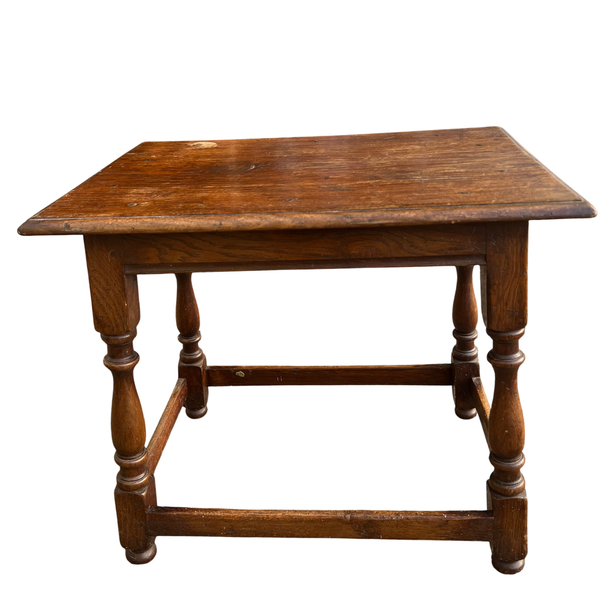 Compact oak side table with turned spindle legs and moulded edge top