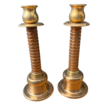 Pair of vintage brass spiral column candlesticks with wide drip trays and polished brass finish
