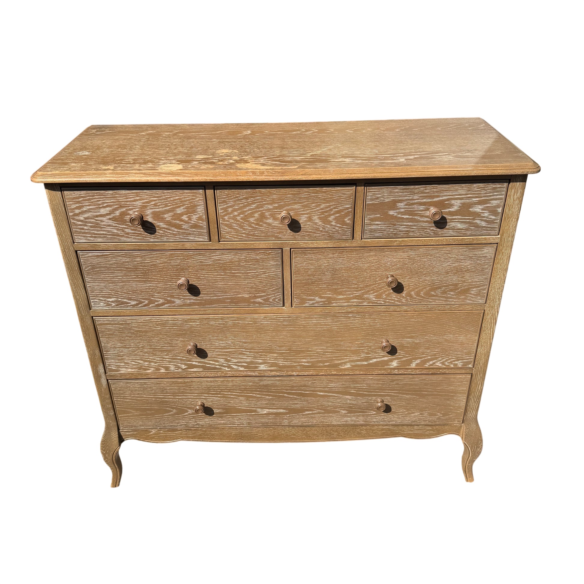 Angled view of painted oak chest showing cabriole-style legs and bead detail around drawers