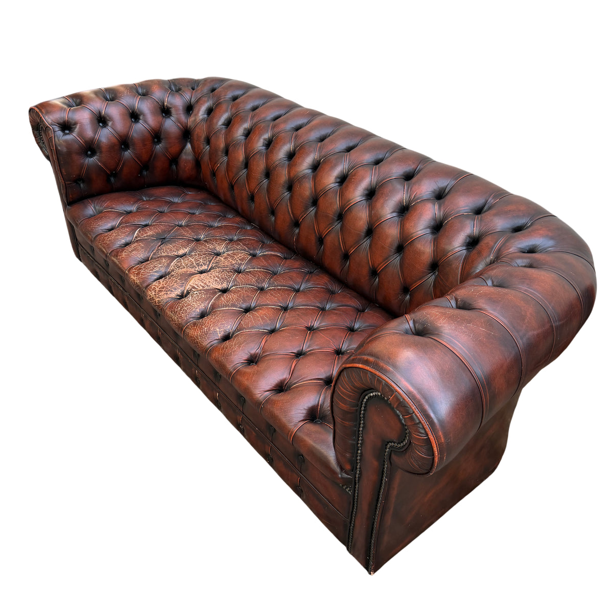 Worn seat cushion area showing cracking and colour loss on leather