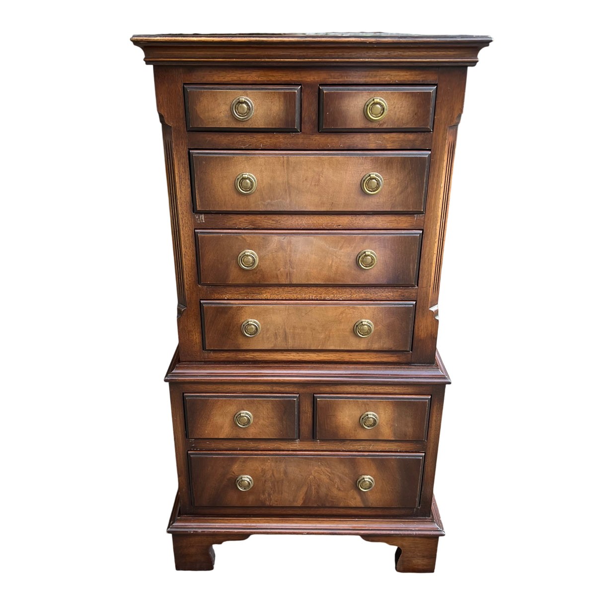 Close up of the chest top showing mahogany veneer and surface wear