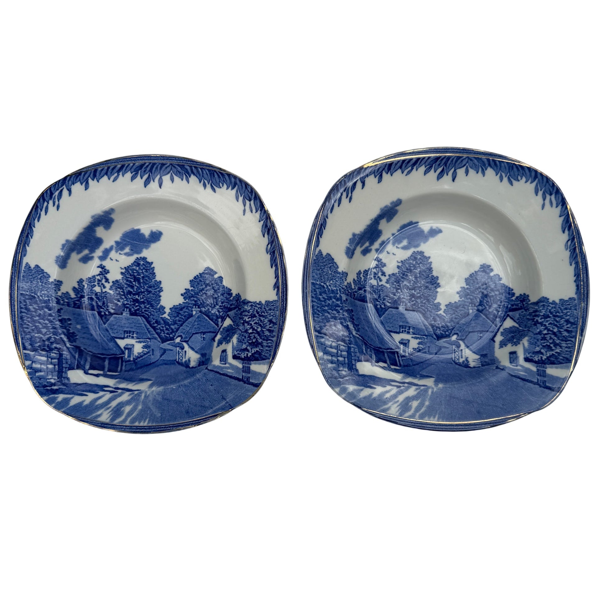 Pair of Burleigh Ware Cockington Forge blue and white ceramic soup bowls with gilt rim