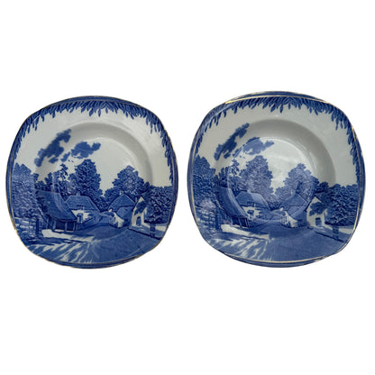 Pair of Burleigh Ware Cockington Forge blue and white ceramic soup bowls with gilt rim