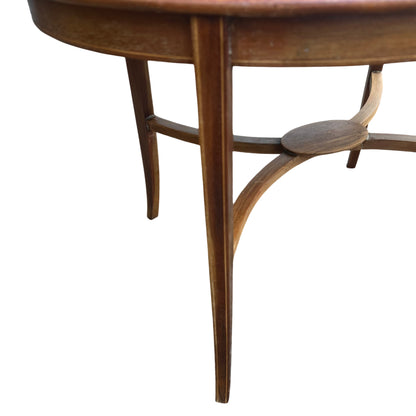 Side view of vintage round table showing rim and leg joinery