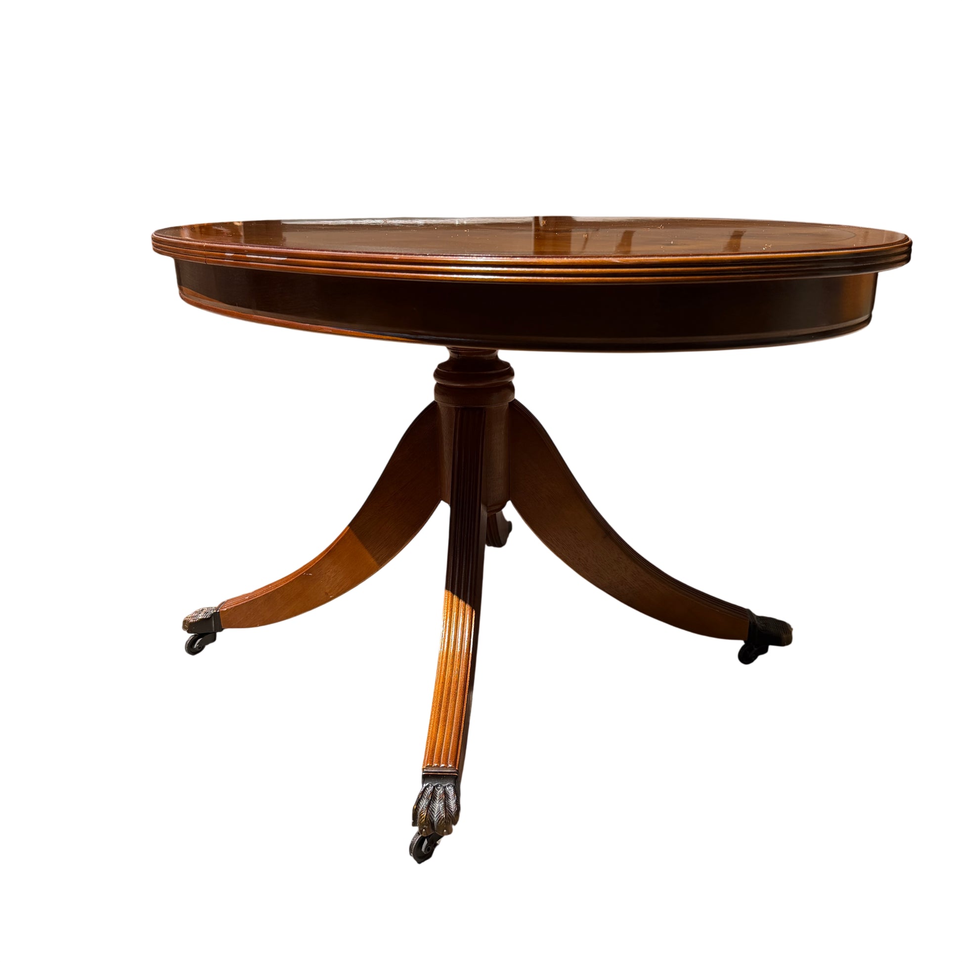 Edge detail of oval table top with contrasting banded border and small edge join