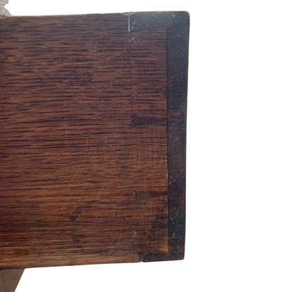 Side view showing barley-twist turned leg of oak console table