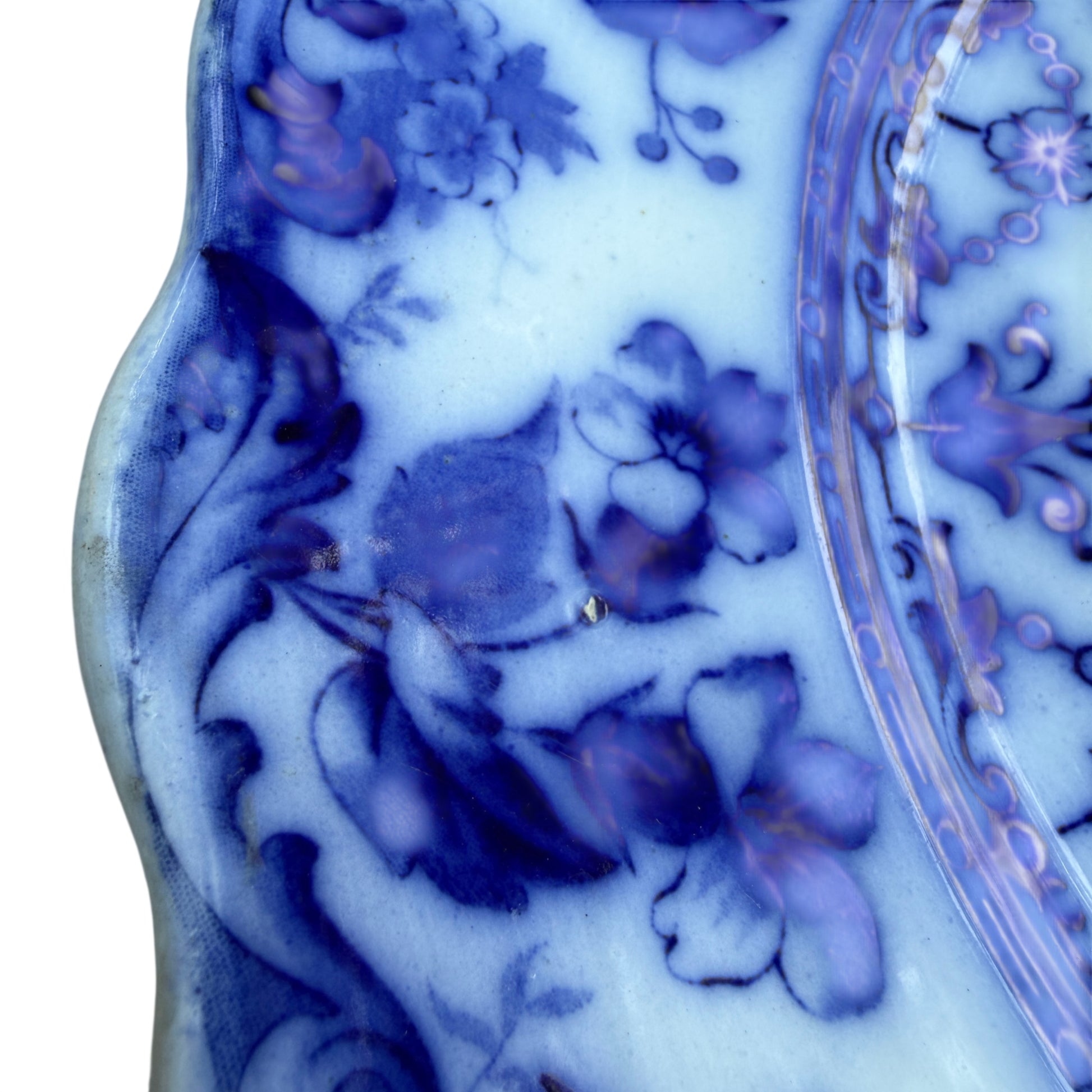 Side view of Staffordshire ceramic platter showing shallow profile and rim decoration