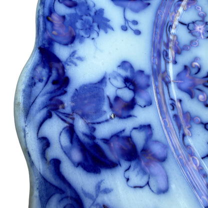Side view of Staffordshire ceramic platter showing shallow profile and rim decoration