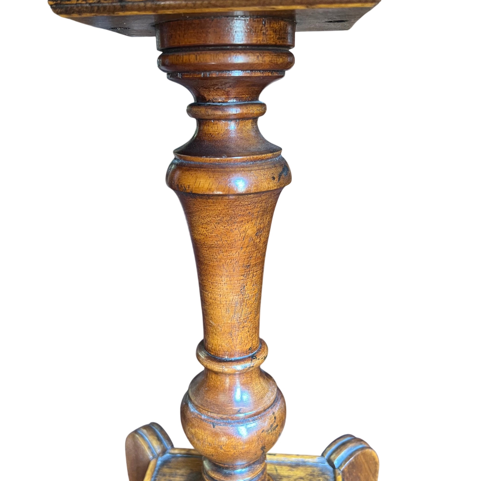 Turned central column and baluster style pedestal of an antique side table