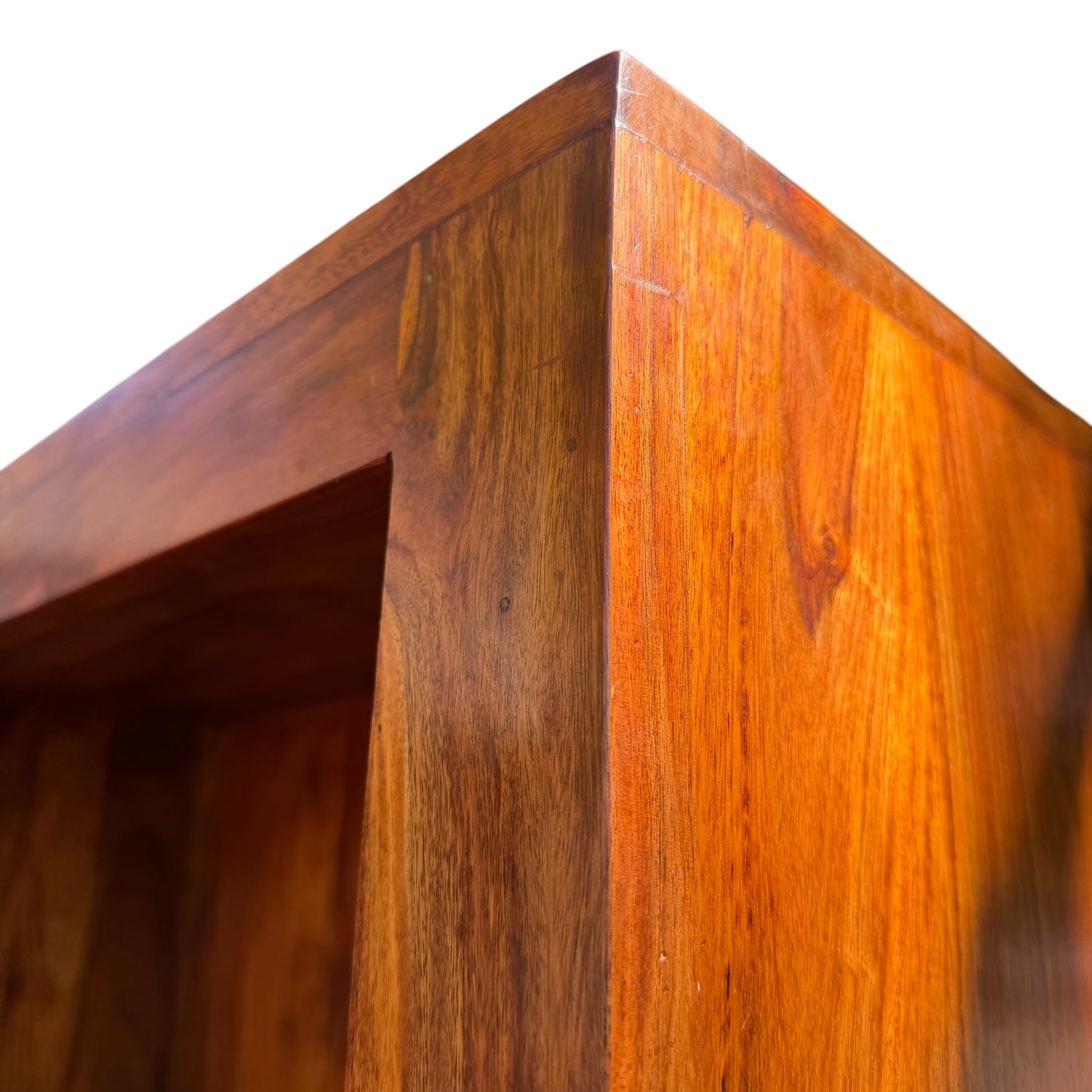 Wooden bookshelf unit showing interior shelf surfaces and grain