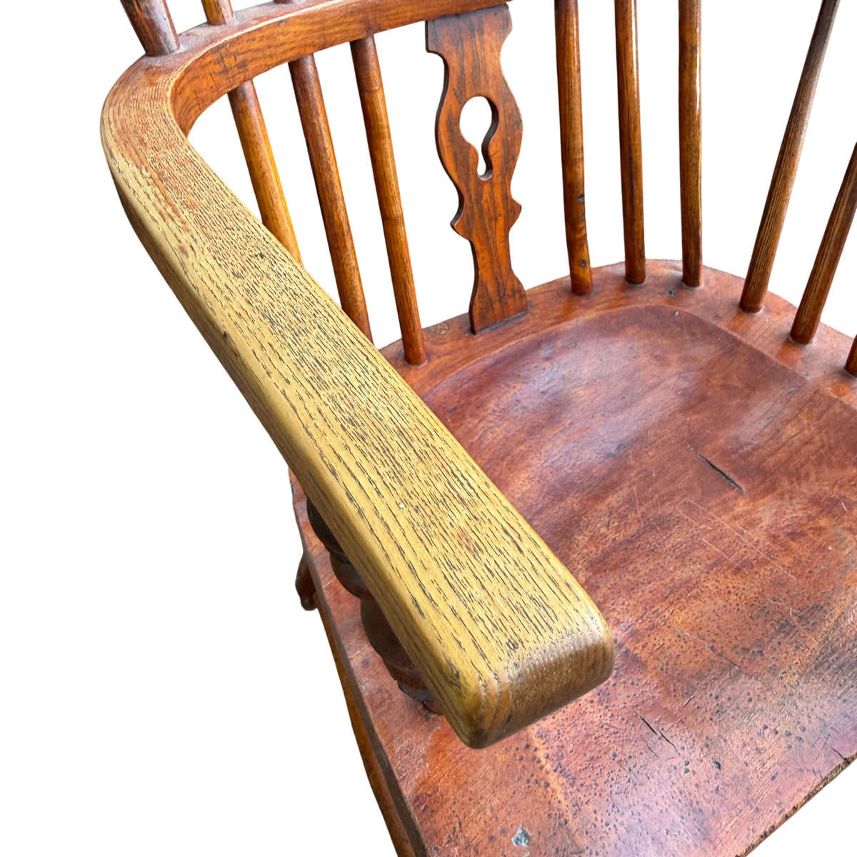 Close-up of turned front leg and stretcher on vintage oak armchair