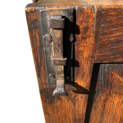 Gothic Revival oak sideboard with carved decorative panels and solid base