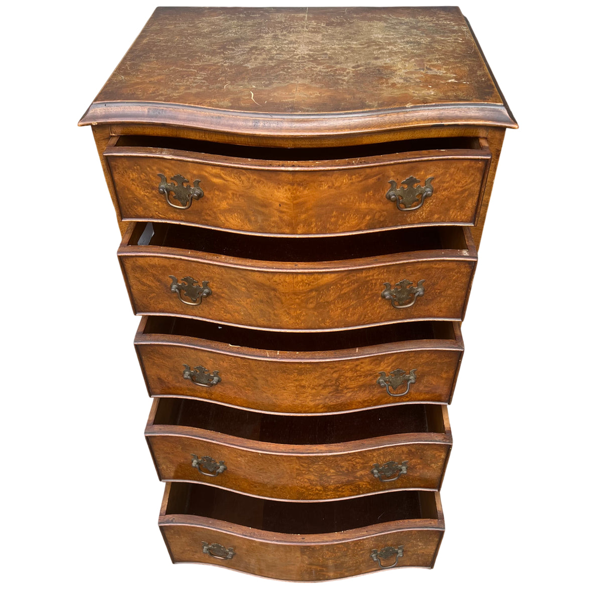 Top view showing worn and marked walnut veneer surface on chest of drawers