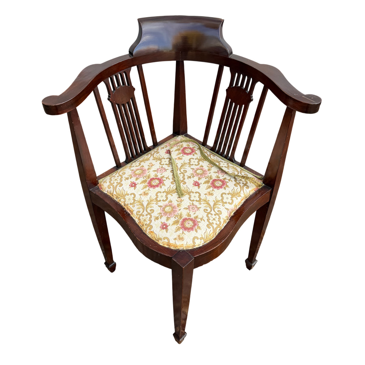 Close view of mahogany crest rail and shaped back on Edwardian corner chair