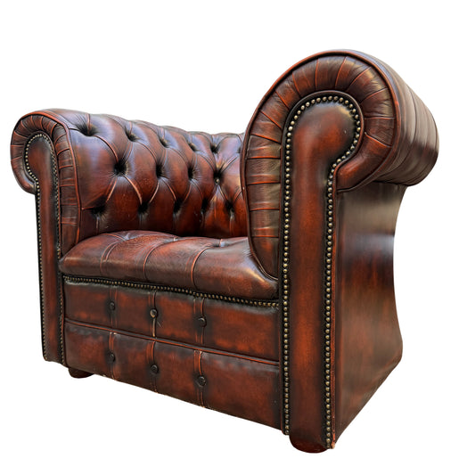 1990s Chesterfield leather armchair in brown with button tufting and studded rolled arm detail