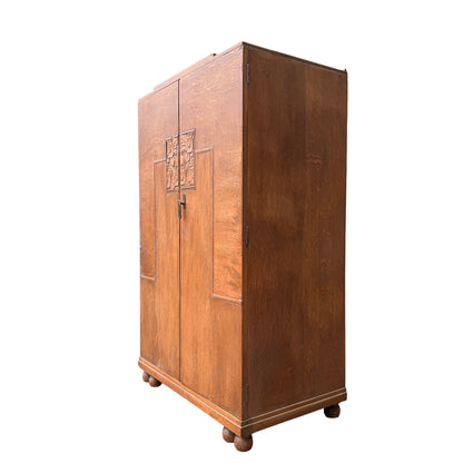 Top view of oak linen press showing stepped top and surface wear