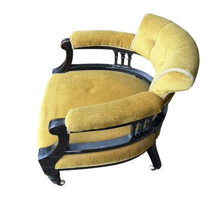 Underside front view showing stretcher and base of ebonised Victorian armchair