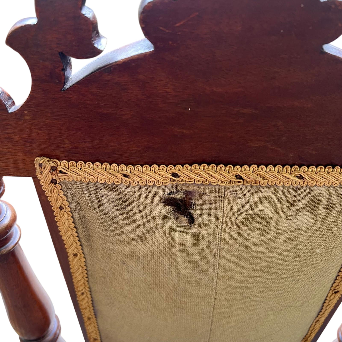 Upholstery edge and braided gimp trim showing wear
