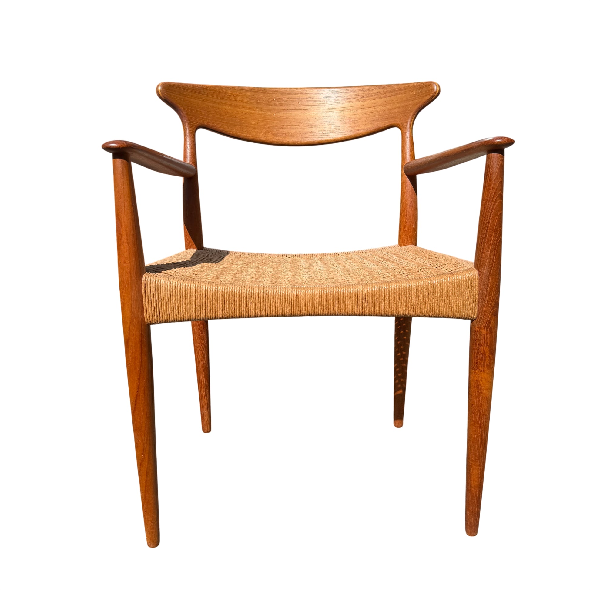 Front view of Danish teak dining chair showing woven paper-cord seat and tapered legs