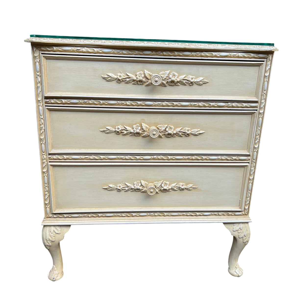 Cream painted chest of drawers with carved floral mouldings and gilt detailing