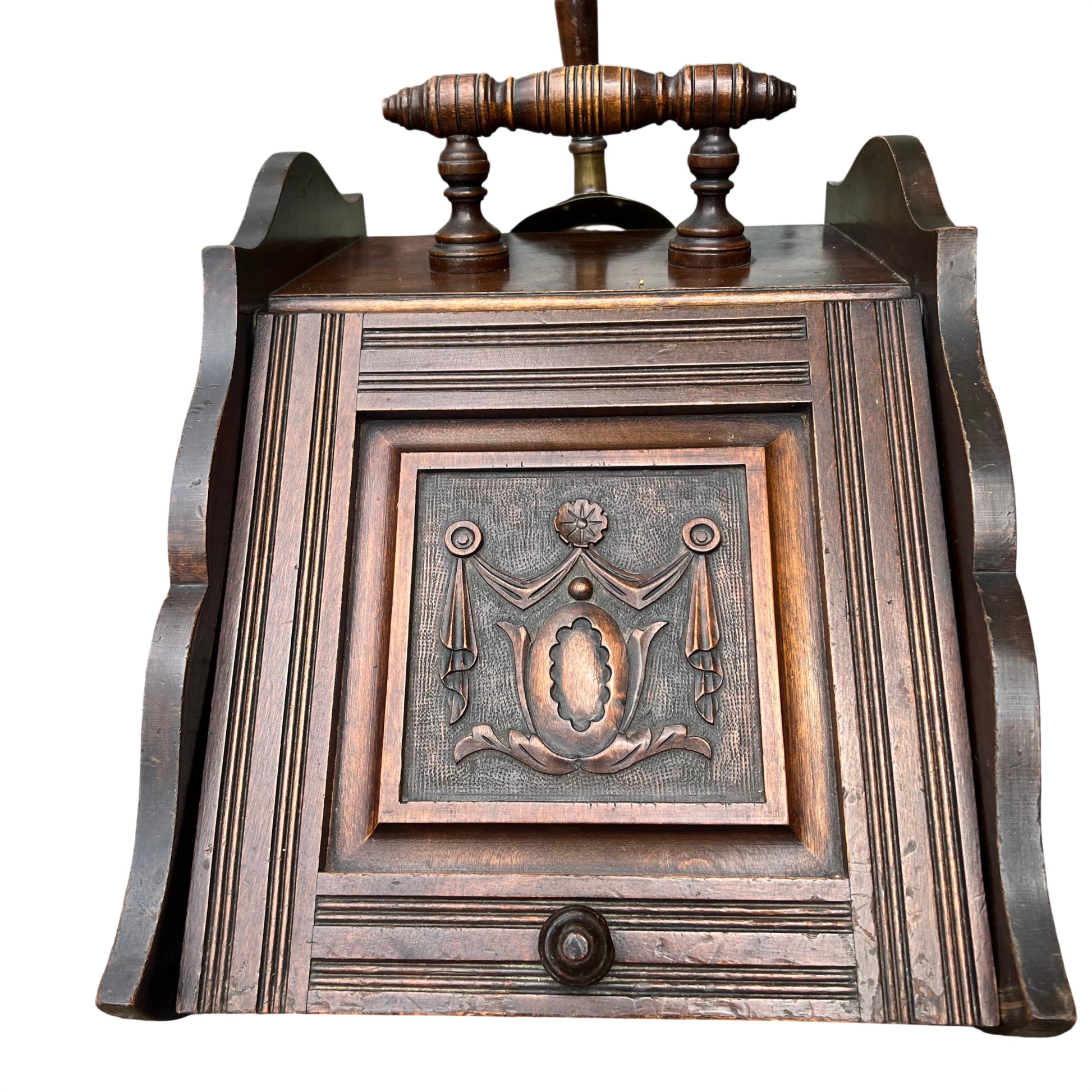 Victorian carved wooden coal scuttle with turned handle brass shovel and decorative carved front