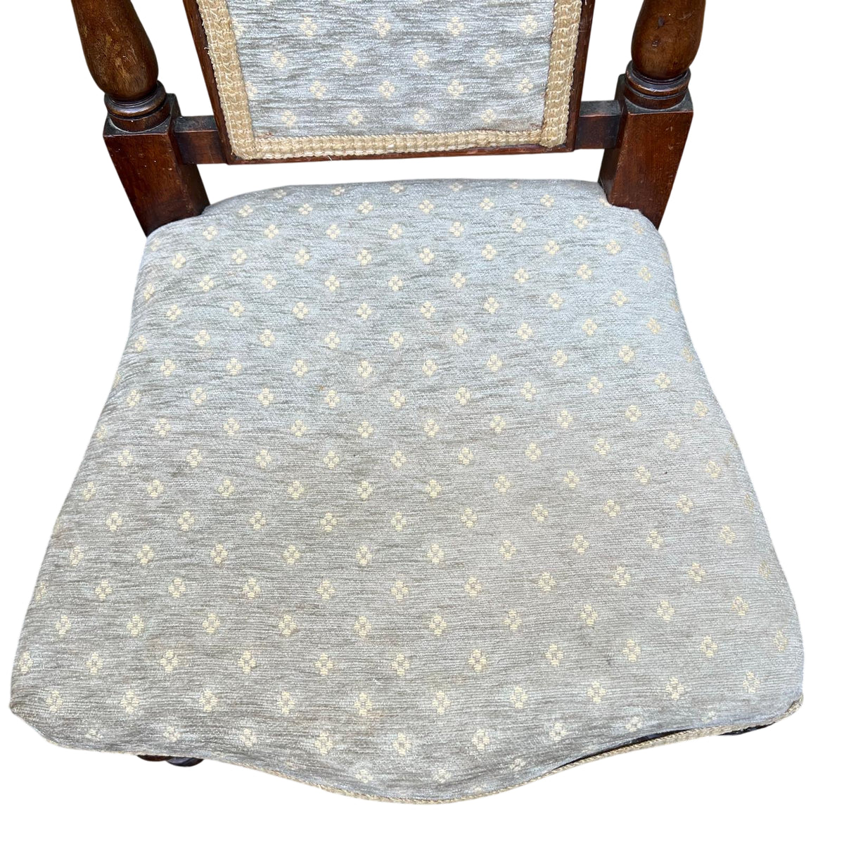 Front view Victorian dining chair with upholstered seat and carved back