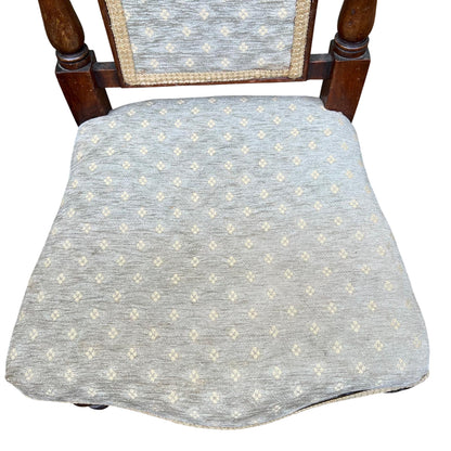 Front view Victorian dining chair with upholstered seat and carved back